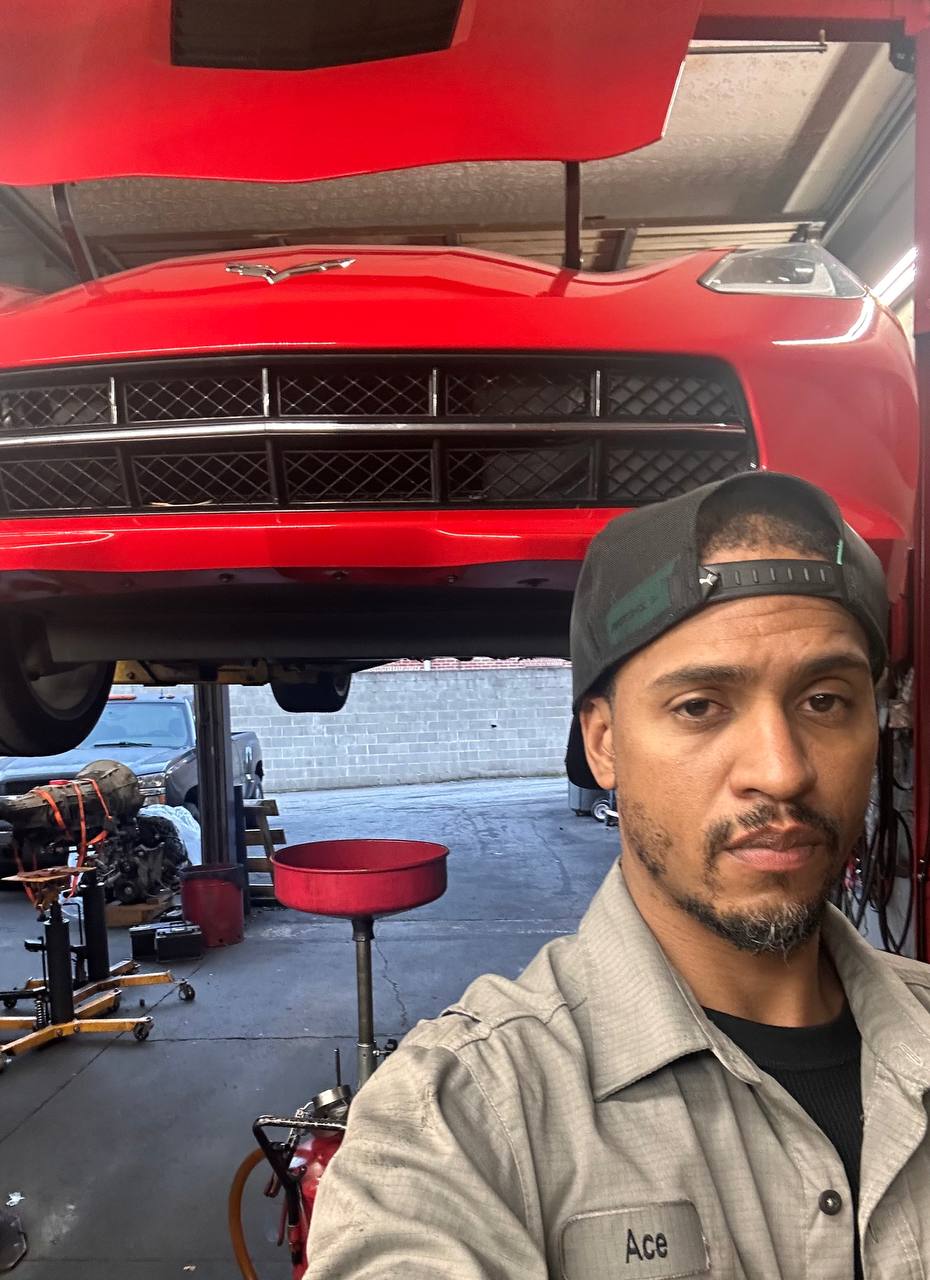 Ace, the mechanic behind Brake N Relax, in uniform at work
